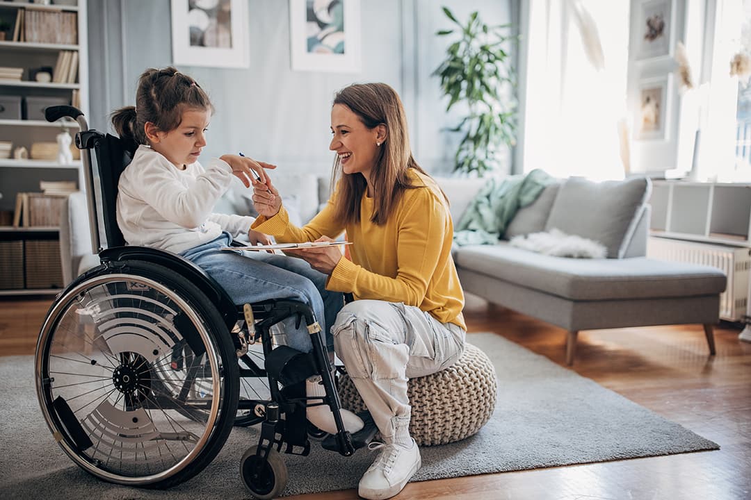 Girl with disability with care provider