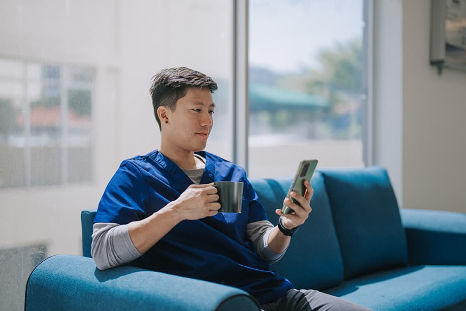 Nurse reading on phone