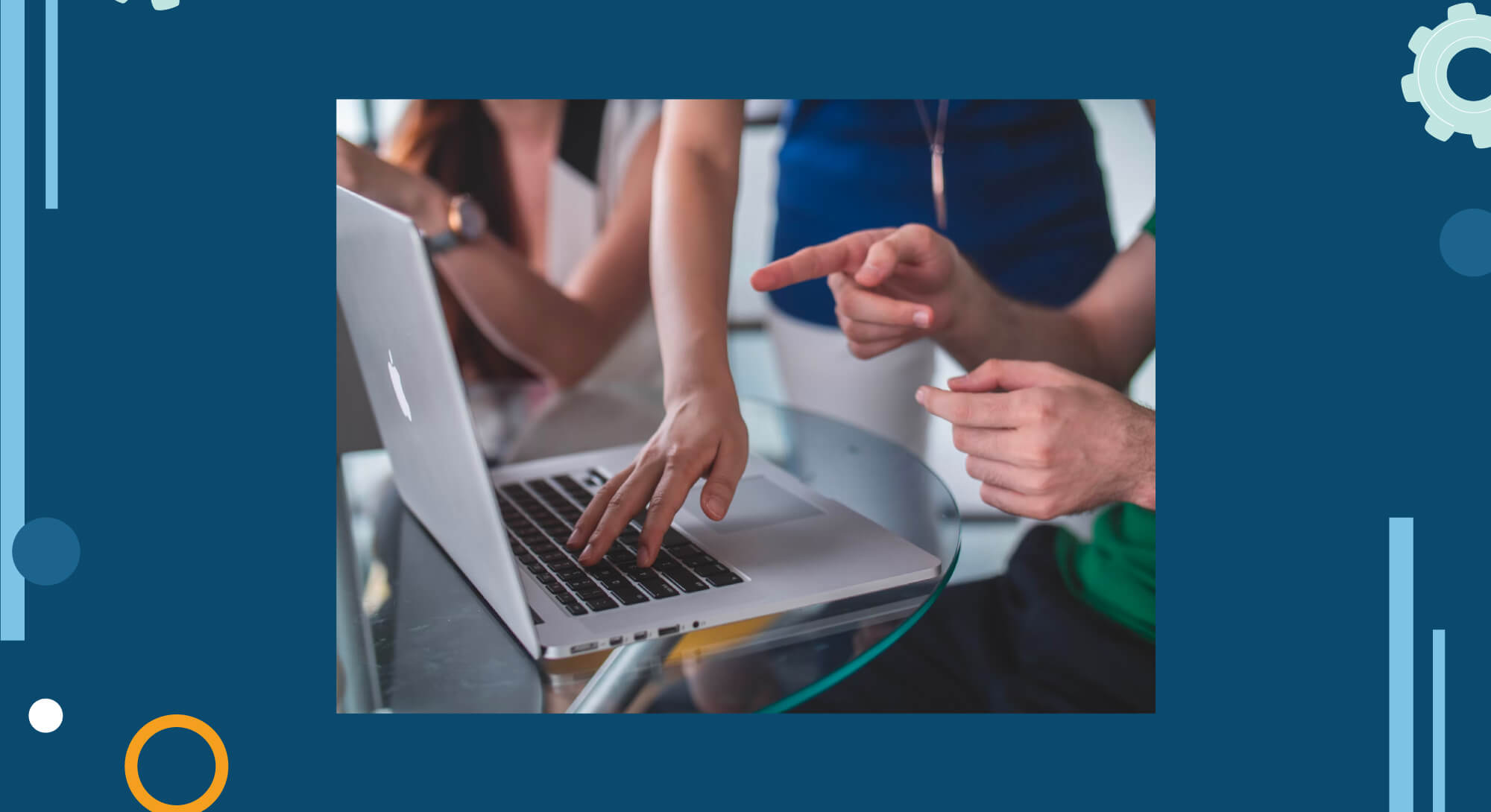 Several people crowding around a laptop