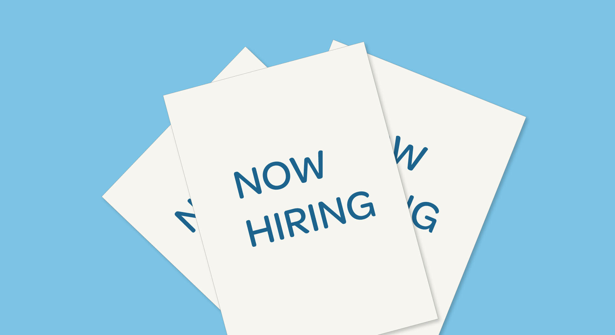Three illustrated white pieces of paper with the words "Now hiring"