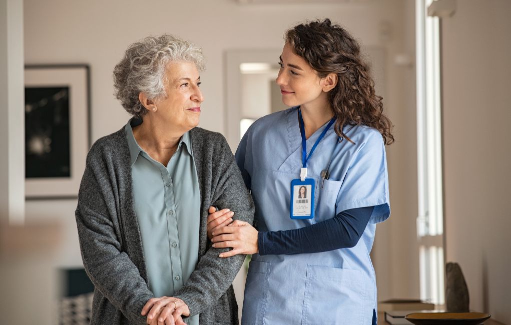 CNA walking with resident