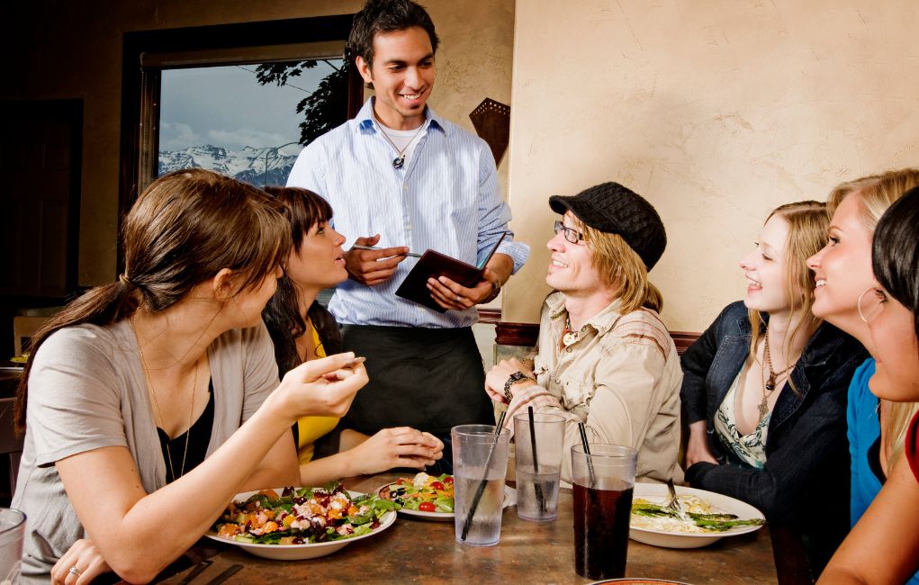 New server waiting on customers at a restaurant